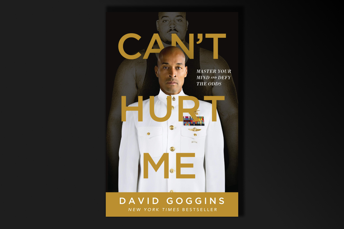 book cover art with the title: Can't Hurt Me text over a man standing in a white uniform