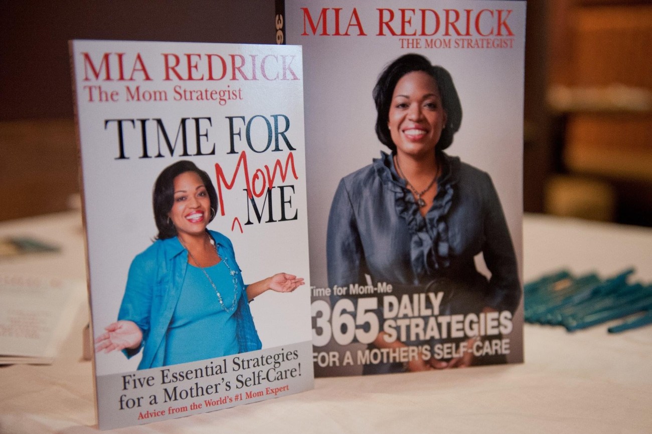 two books on a table with the title by Mia Redrick, a mom strategist