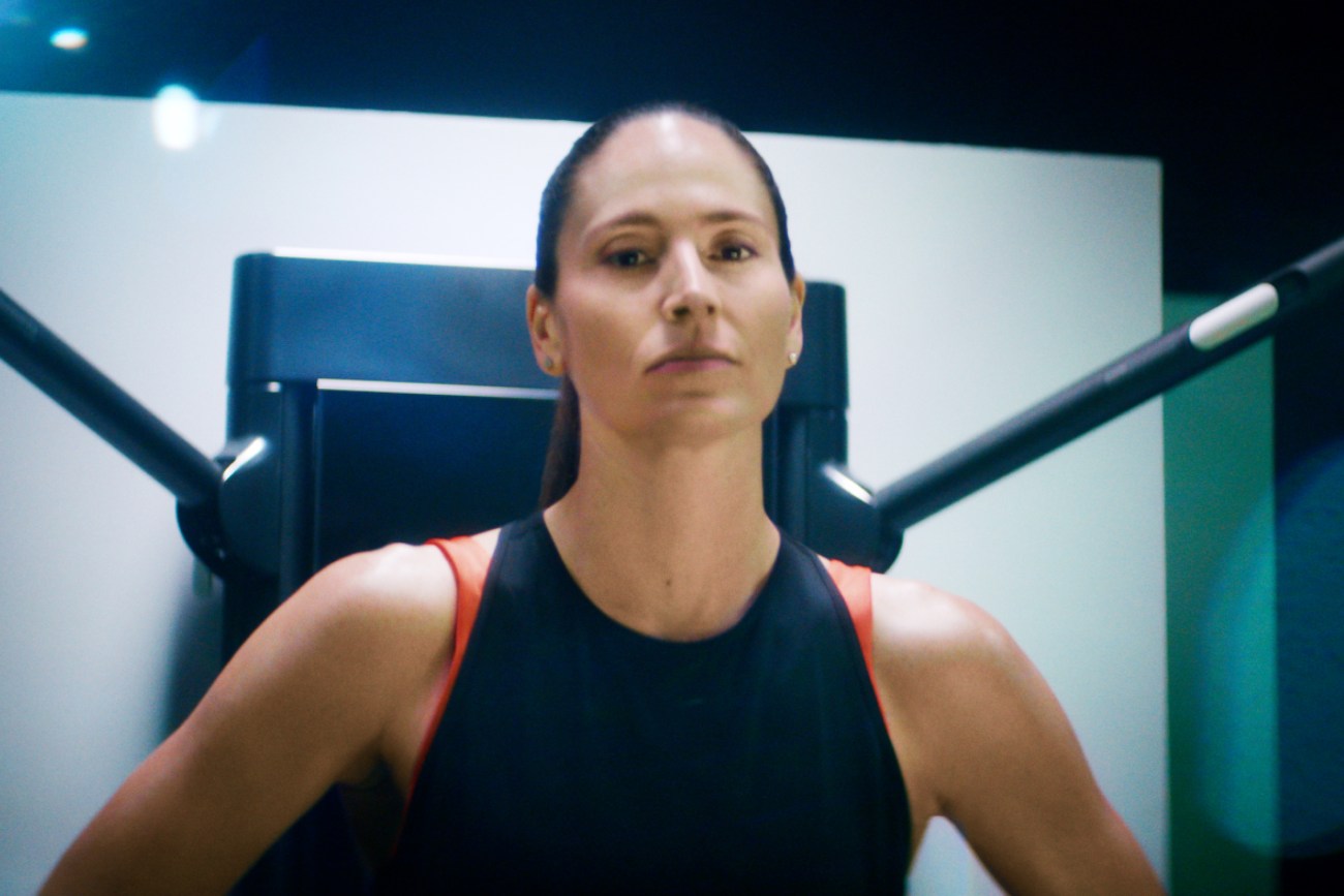 sue bird stands in front of her tonal looking strong 