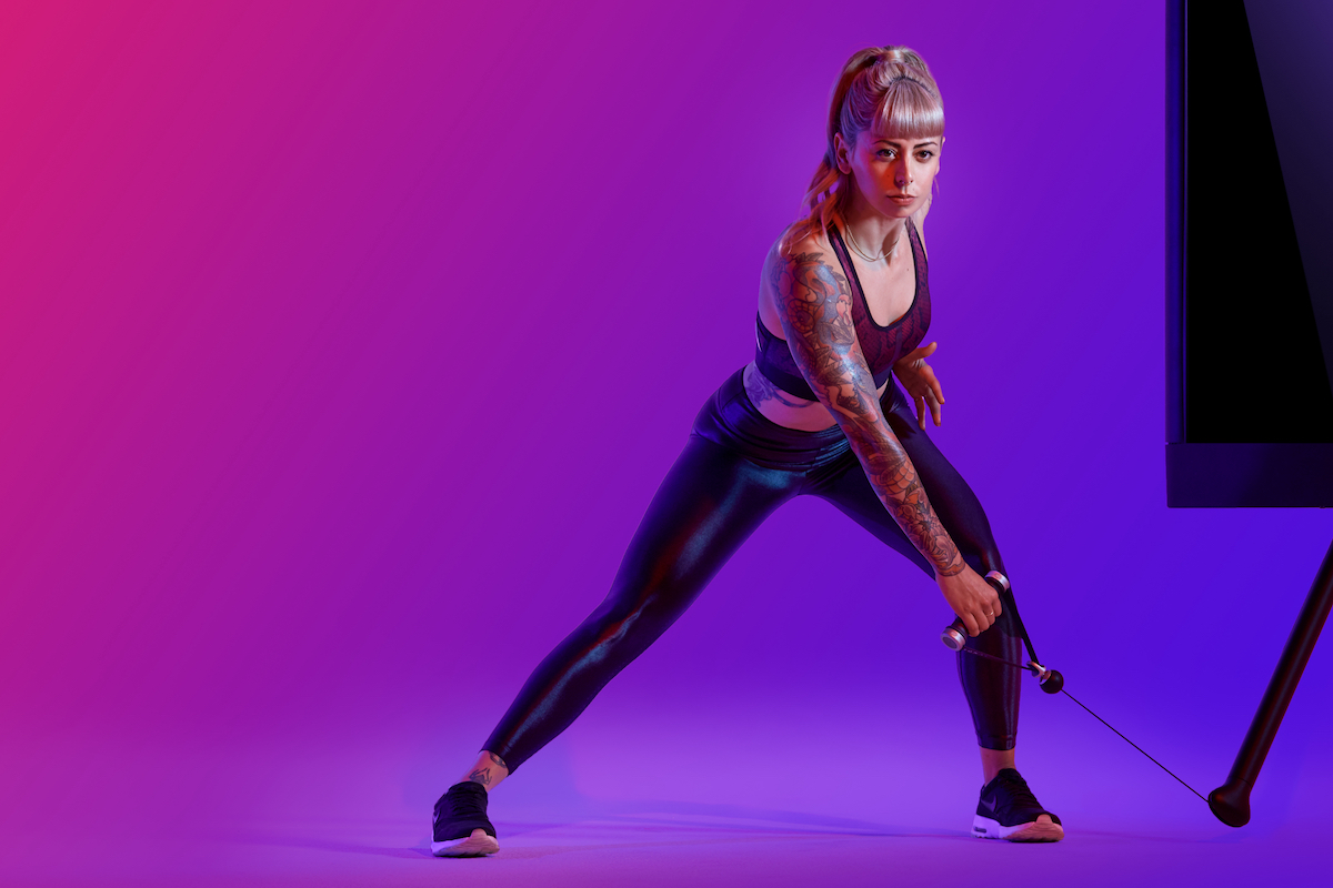 a woman doing a side lunge