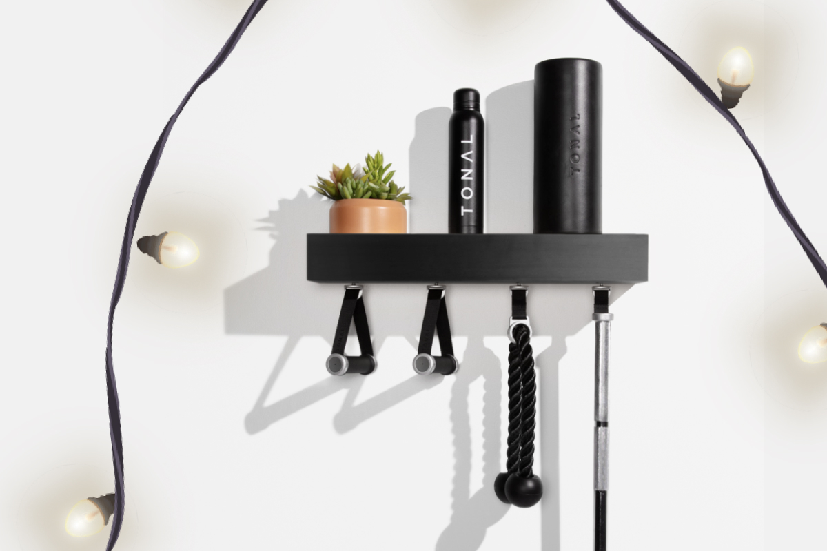 a black shelf with a water bottle, and accessories hanging from it 