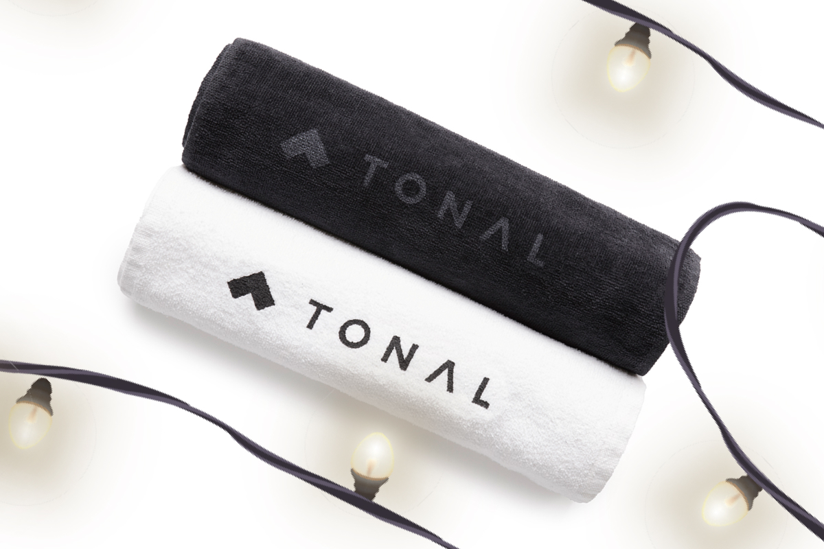 one black and one white sweat towel with Tonal written on them 