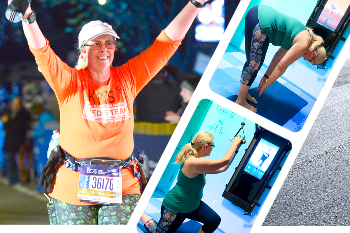 a woman holding her arms up in success after completing the NYC marathon