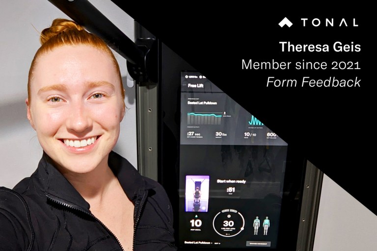 Photo of Tonal member in front of Tonal to highlight her favorite feature: Form Feedback