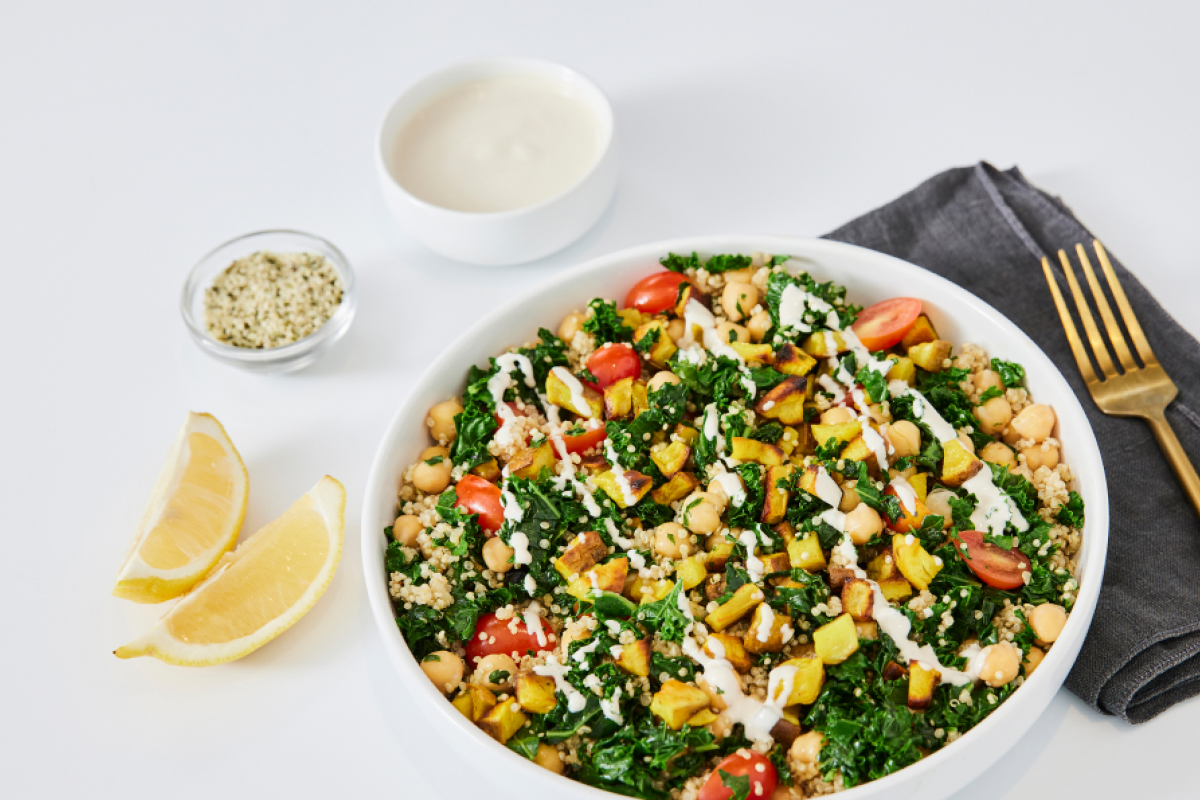a bowl of kale, chickpeas and quinoa