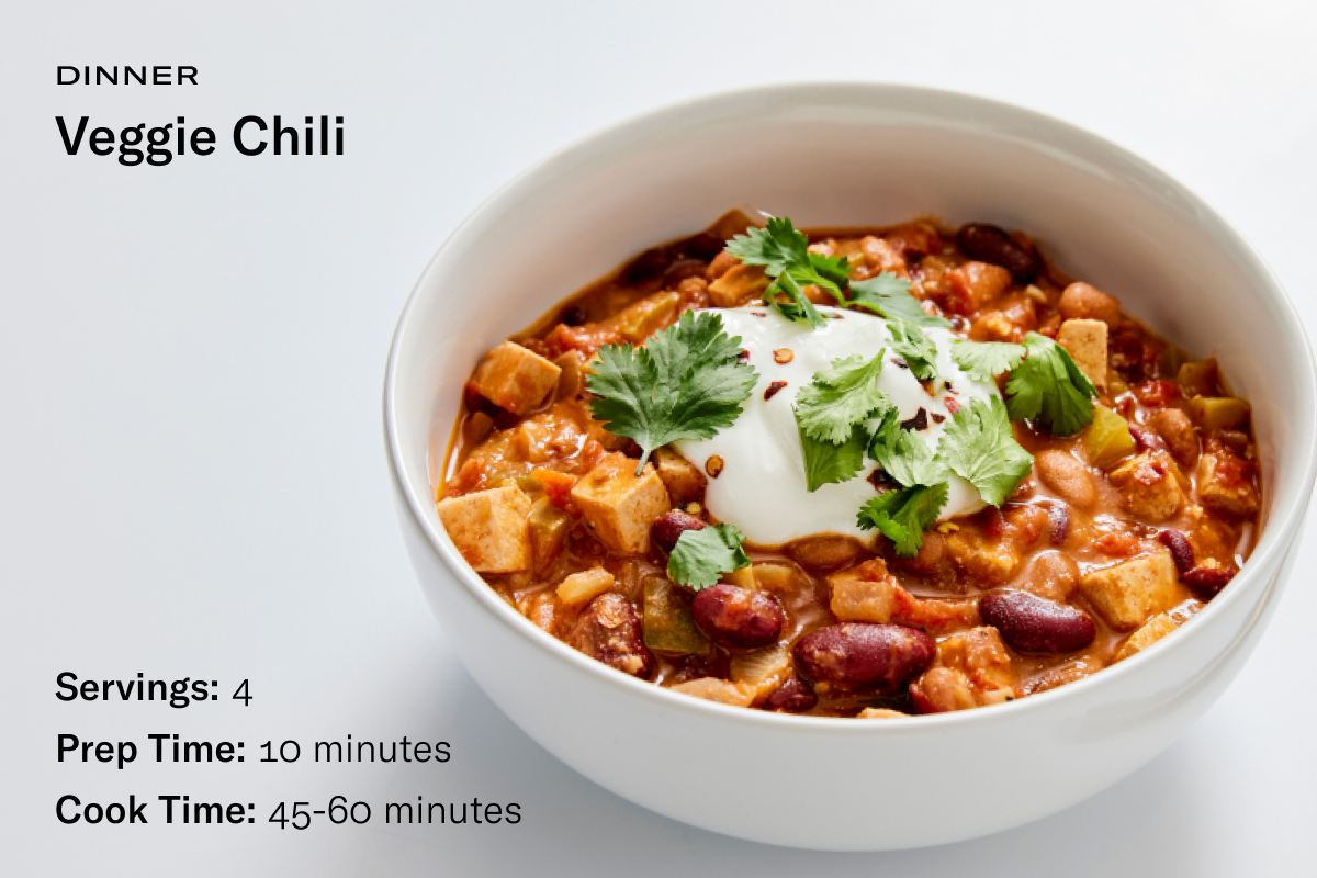 A recipe card with an image of a bowl of colorful veggie chili with the following text: Servings: 4, Prep Time: 10 Minutes, Cook Time: 45-60 minutes. 