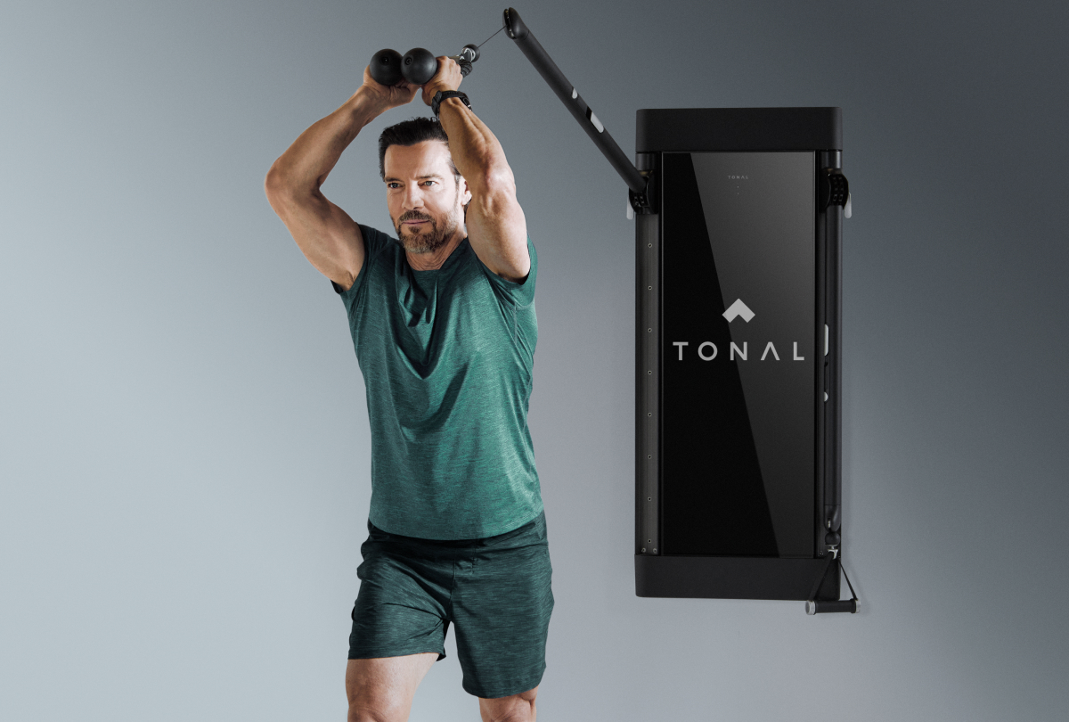 Tony Horton doing tricep exercises on Tonal for his new workout program. 