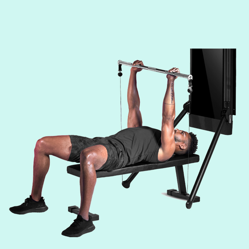 Barbell bench press on Tonal's all-in-one home gym.