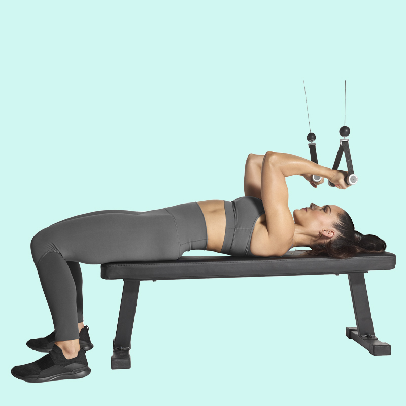 Lying face curl on Tonal's all-in-one home gym.