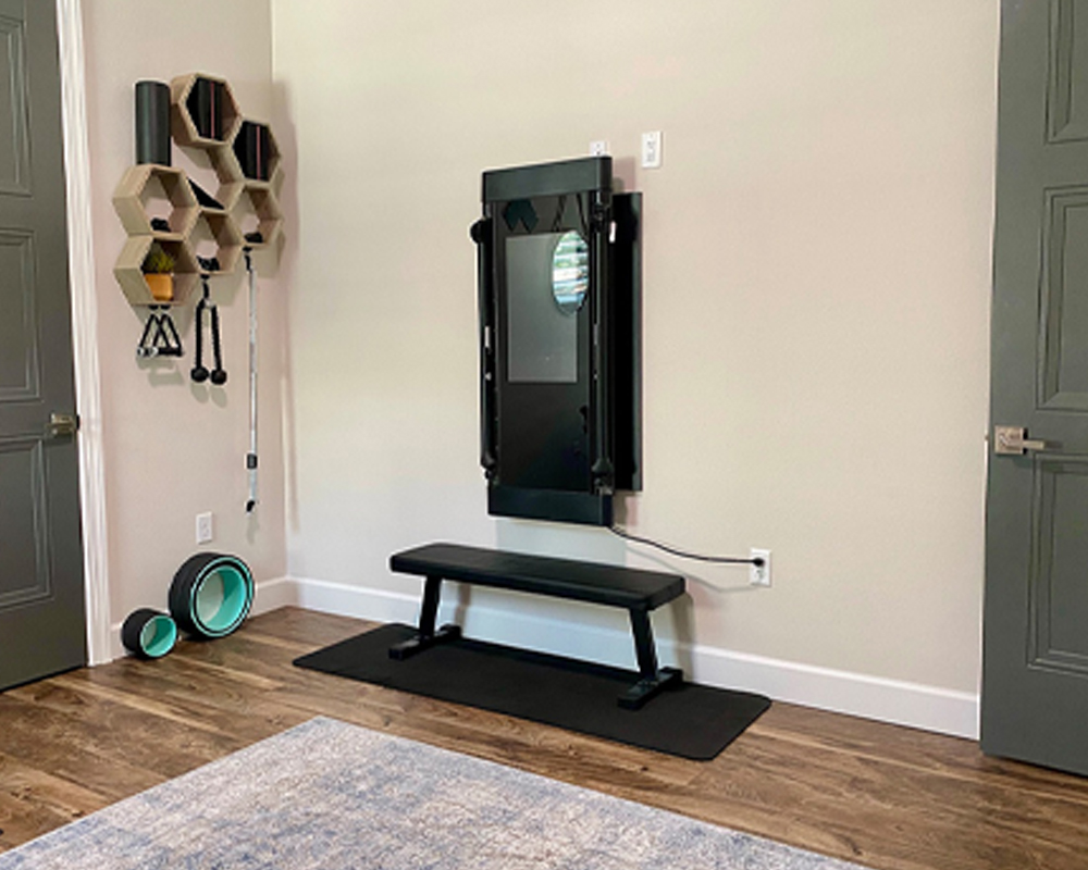 Tonal's compact home gym equipment in a member's small space.