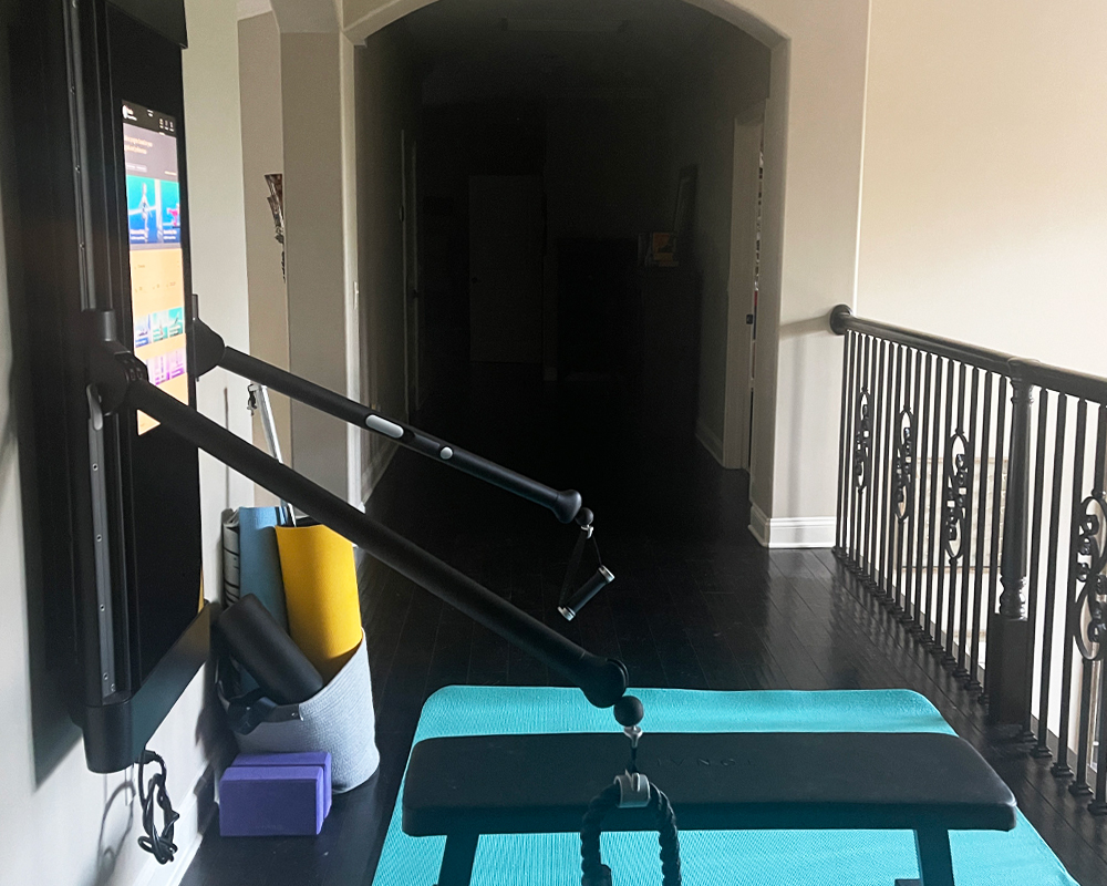 Tonal member's second-floor landing compact home gym installation. 