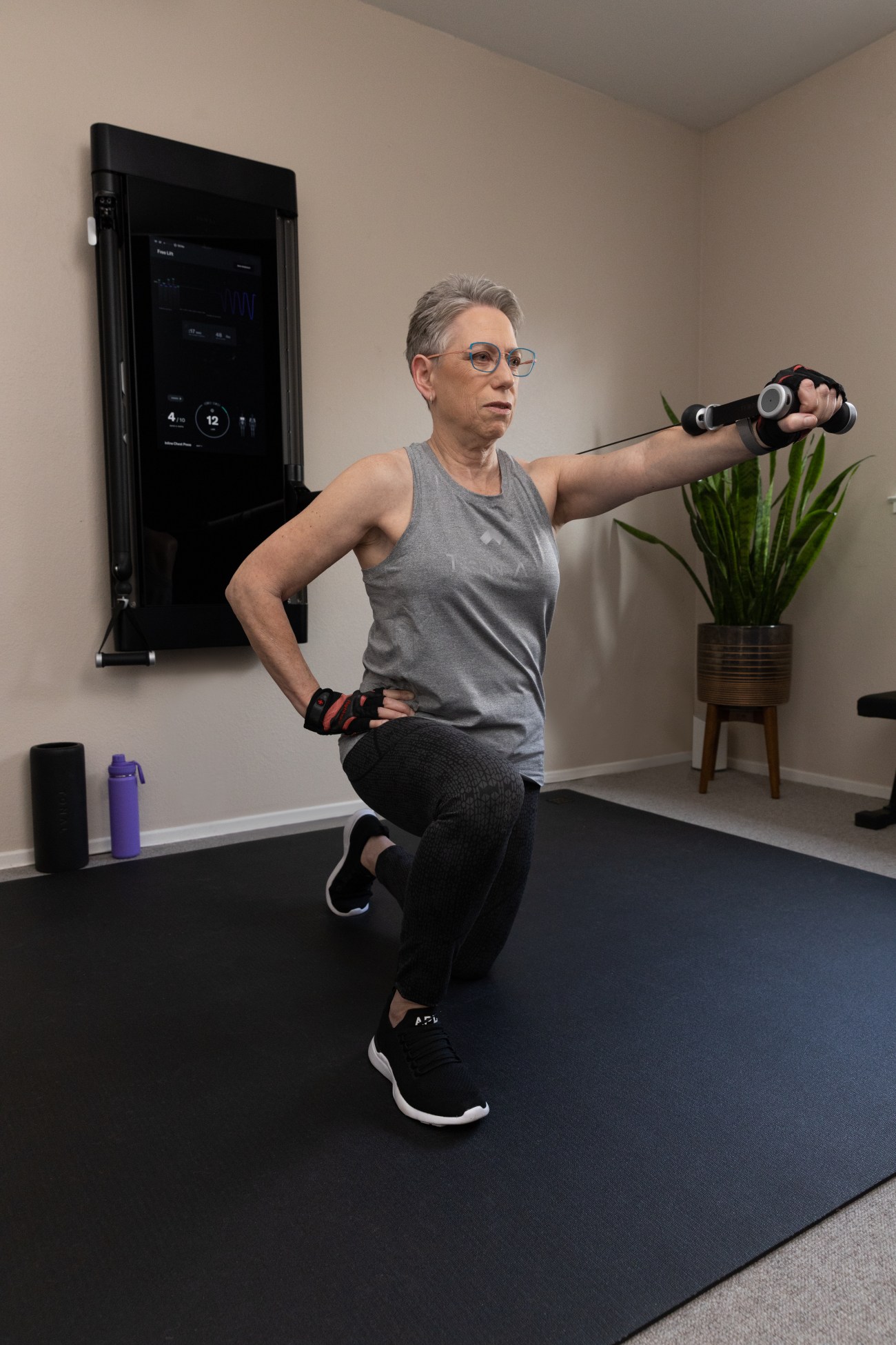Arlene Kraushaar working out on Tonal in her home gym.