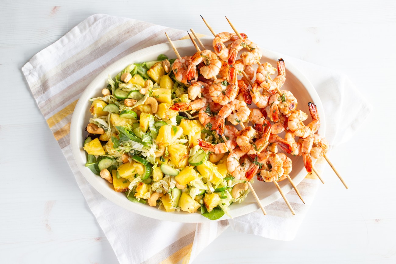 grilled shrimp kebabs and pineapple salad.