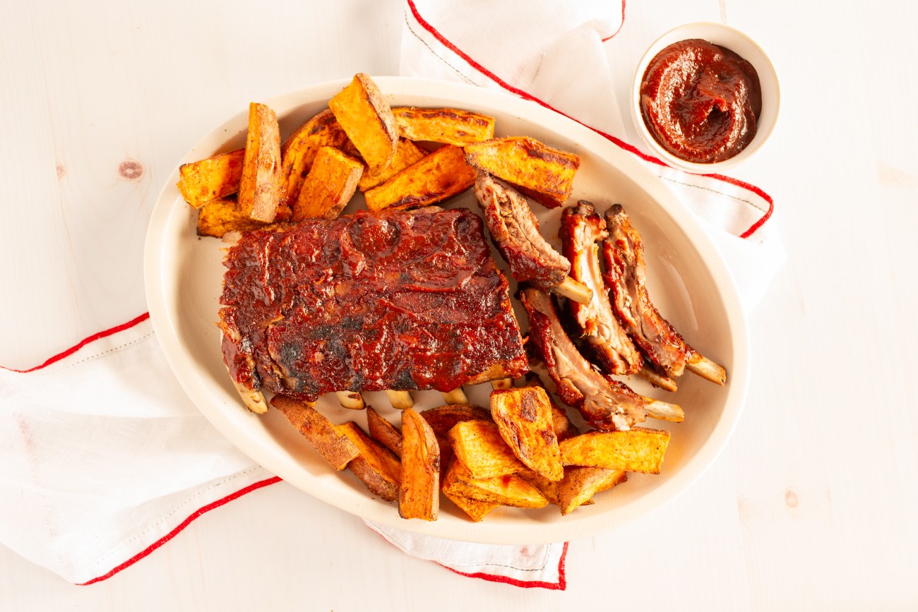BBQ pork ribs with spiced sweet potato wedges